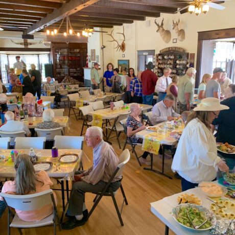 Lively group enjoying a timeless gathering space with rustic decor