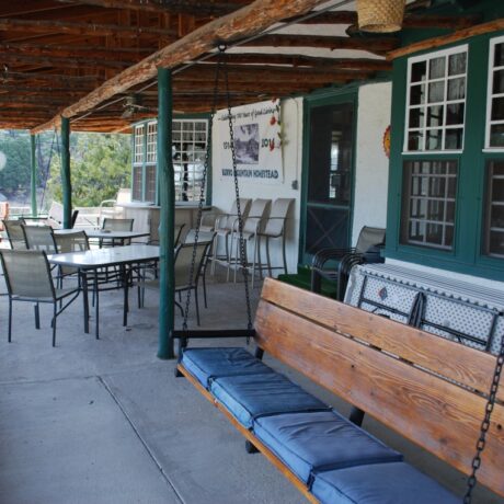 Outdoor lounge area on a mountain with seating and scenic view